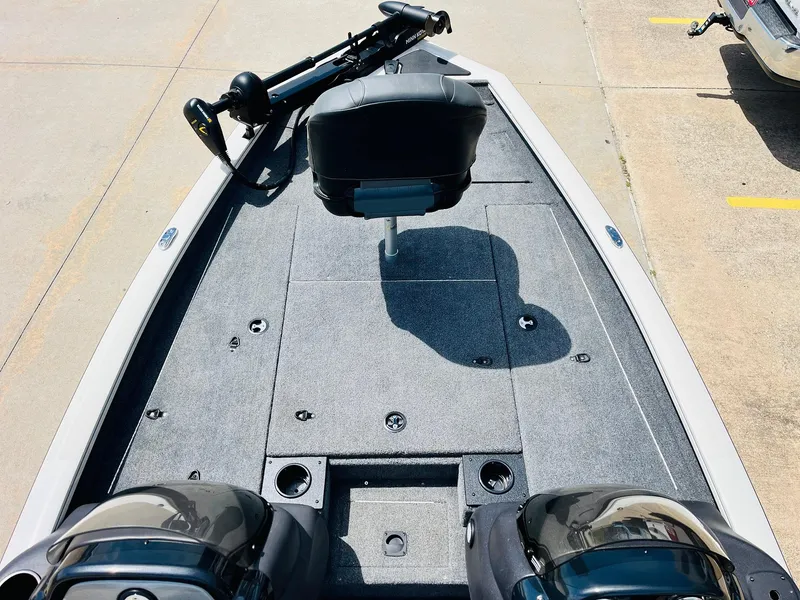 Slide: The Image of 2024 Tracker Pro Team 175 TXW fishing boat deck with seating and trolling motor. - 7