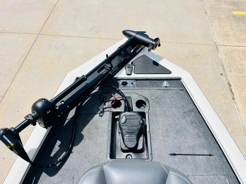 Slide: The Image of 2024 Tracker Pro Team 175 TXW boat deck with trolling motor and control panel. - 8