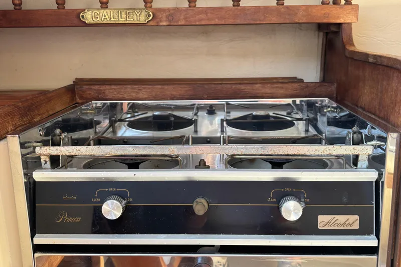 Slide: The Image of Vintage alcohol stove in 1983 Catalina 25 sailboat galley, featuring classic design elements. - 10