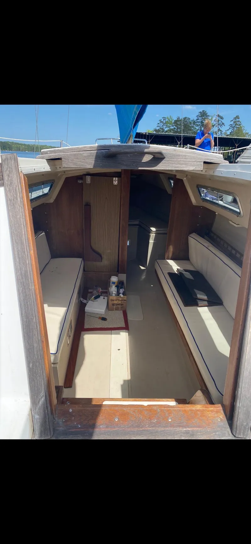 Slide: The Image of Interior of 1983 Catalina 25 sailboat with seating and wooden accents. - 3