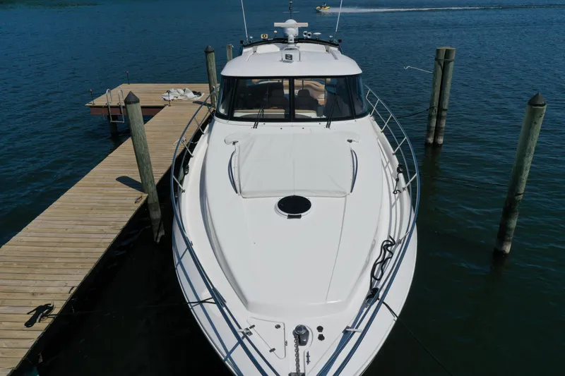 Slide: The Image of 2007 Neptunus 55 Cabrio yacht docked on calm water. - 10