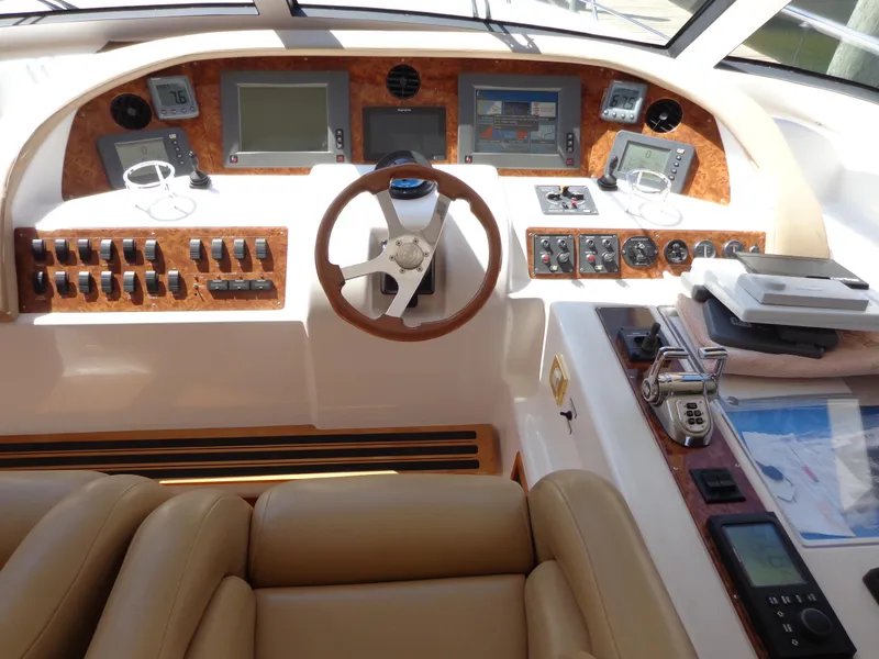 Slide: The Image of Helm of 2007 Neptunus 55 Cabrio yacht with navigation instruments and controls. - 15
