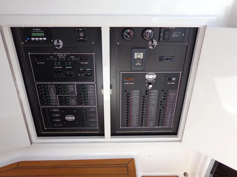 Slide: The Image of Electrical control panel of 2007 Neptunus 55 Cabrio yacht, featuring various switches and gauges. - 16