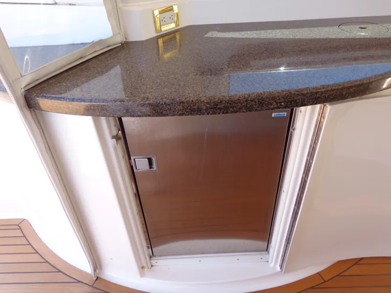 Slide: The Image of Luxury yacht Neptunus 55 Cabrio 2007 interior with sleek countertop and stainless steel cabinet. - 17