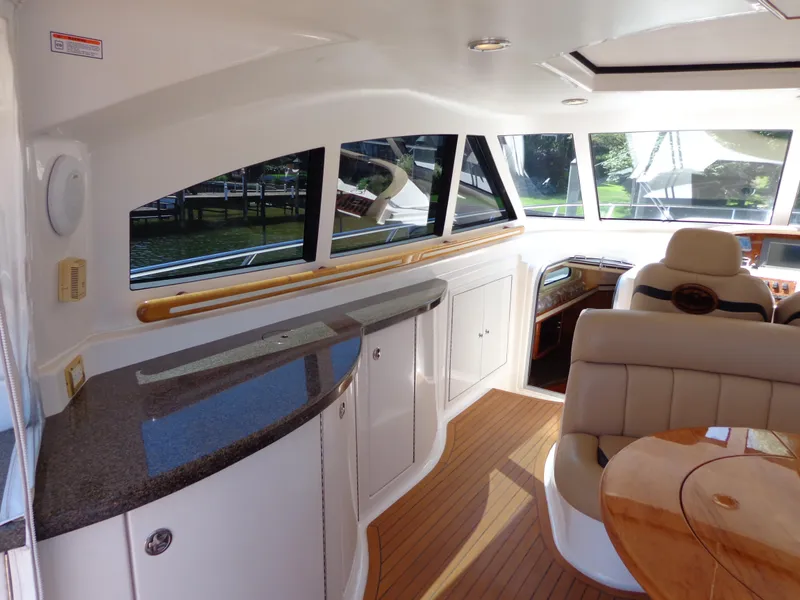 Slide: The Image of Luxurious interior of 2007 Neptunus 55 Cabrio yacht with elegant seating and wood accents. - 19