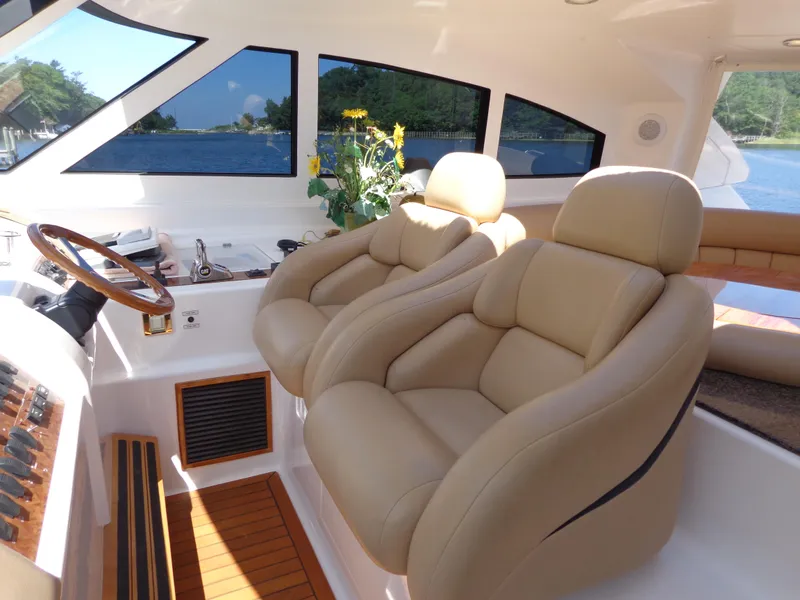 Slide: The Image of Luxurious interior of 2007 Neptunus 55 Cabrio yacht with plush seating and scenic views. - 20