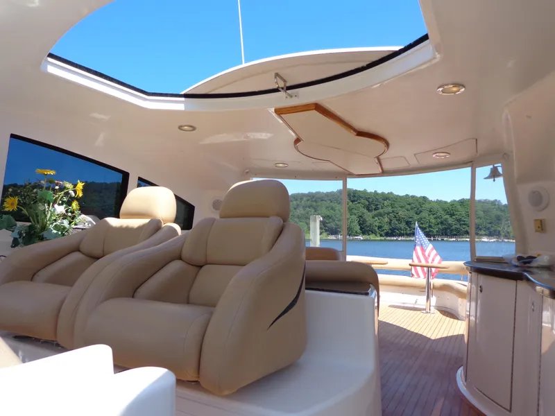 Slide: The Image of Luxurious interior of 2007 Neptunus 55 Cabrio yacht with leather seating and scenic water view. - 21