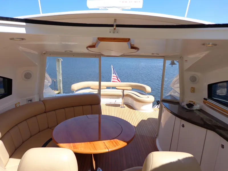 Slide: The Image of Luxurious 2007 Neptunus 55 Cabrio yacht interior with elegant seating and ocean view. - 22