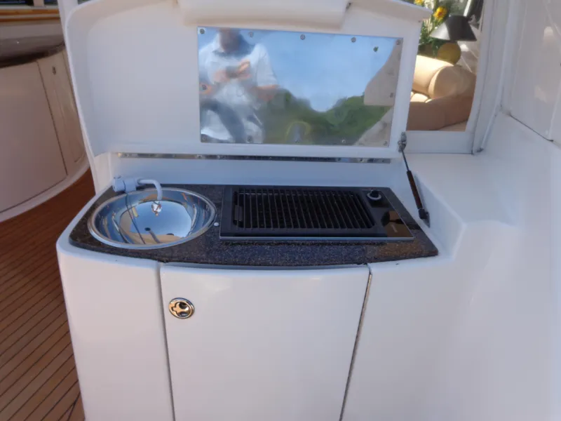 Slide: The Image of Outdoor kitchen on 2007 Neptunus 55 Cabrio yacht with sink and grill. - 23