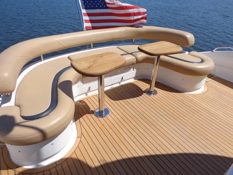 Slide: The Image of Luxury seating area on 2007 Neptunus 55 Cabrio yacht with American flag. - 24