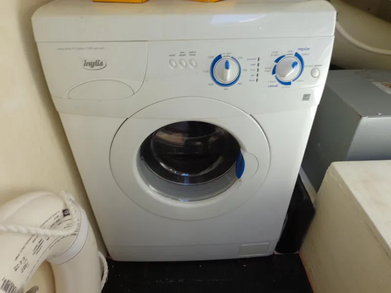 Slide: The Image of Front-loading Inglis washing machine in a 2007 Neptunus 55 Cabrio yacht. - 26