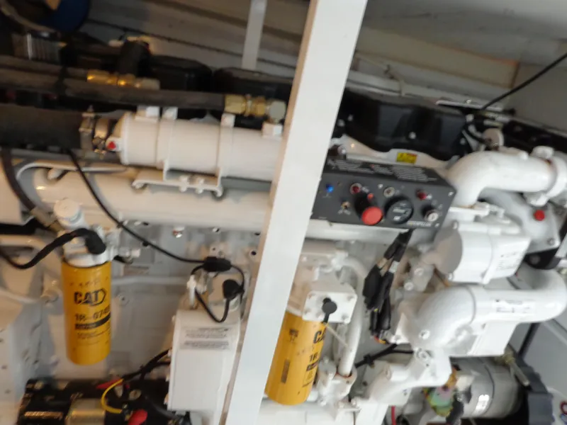 Slide: The Image of Engine compartment of a 2007 Neptunus 55 Cabrio yacht, featuring mechanical components and filters. - 30