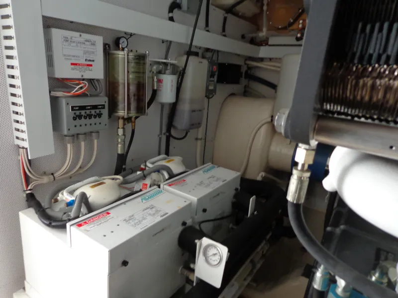Slide: The Image of Engine room of 2007 Neptunus 55 Cabrio yacht, showcasing mechanical components and systems. - 32