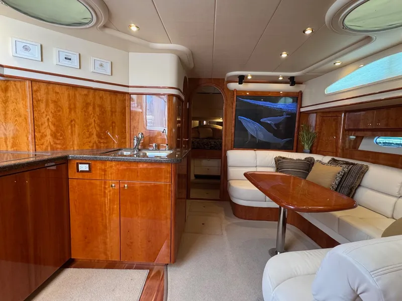 Slide: The Image of Luxurious 2007 Neptunus 55 Cabrio yacht interior with elegant wood finishes and cozy seating area. - 37