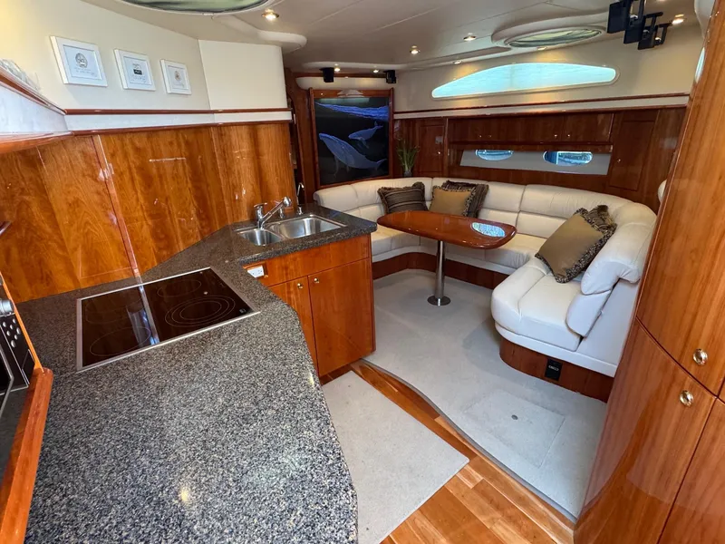 Slide: The Image of Luxurious 2007 Neptunus 55 Cabrio yacht interior with elegant wood finishes and modern amenities. - 38