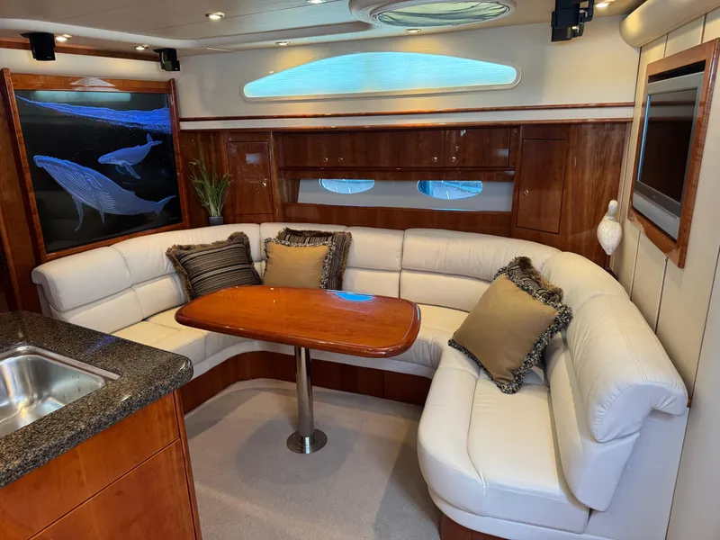 Slide: The Image of Luxurious 2007 Neptunus 55 Cabrio yacht interior with elegant seating and marine artwork. - 39