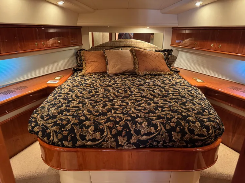 Slide: The Image of Luxurious cabin interior of 2007 Neptunus 55 Cabrio yacht with elegant bedding and wood finish. - 41