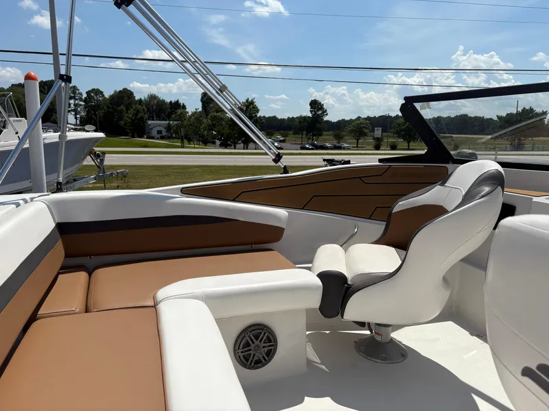 Slide: The Image of 2023 Starcraft SVX 190 OB DC boat interior with tan and white seating. - 9