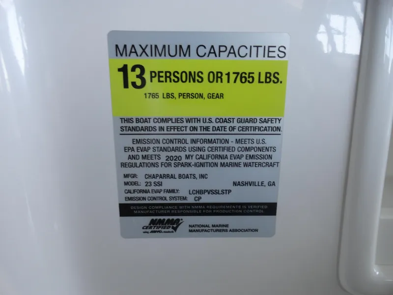 Slide: The Image of 2020 Chaparral 23 SSi capacity label: 13 persons or 1765 lbs, US Coast Guard compliant. - 12