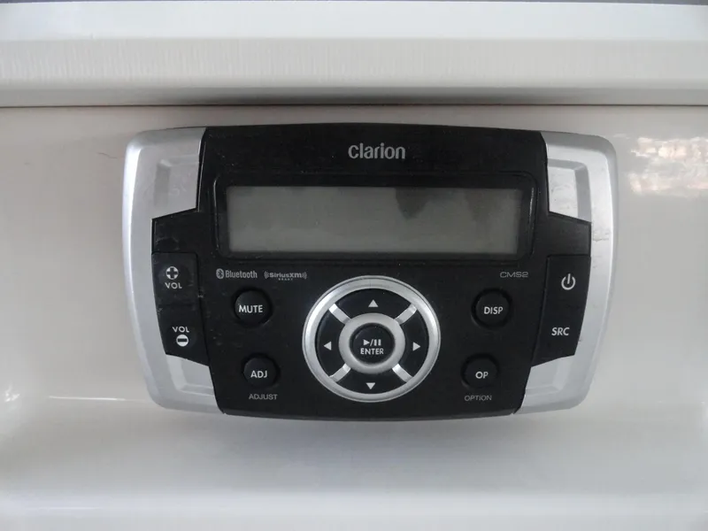 Slide: The Image of Clarion CMS2 stereo system in 2020 Chaparral 23 SSi boat, featuring Bluetooth connectivity. - 14