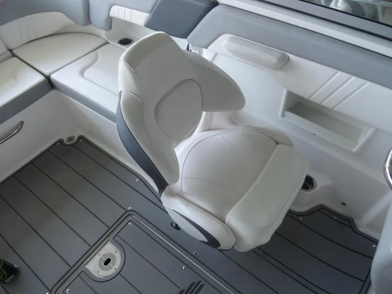 Slide: The Image of 2020 Chaparral 23 SSi boat interior with white seating and gray flooring. - 15
