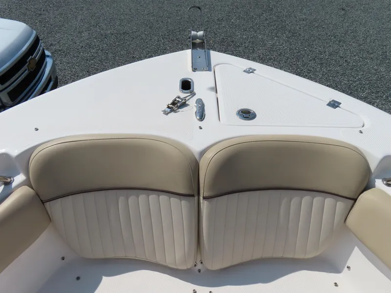 Slide: The Image of 2018 Sea Fox 226 Commander boat bow with beige seating and storage compartment. - 13