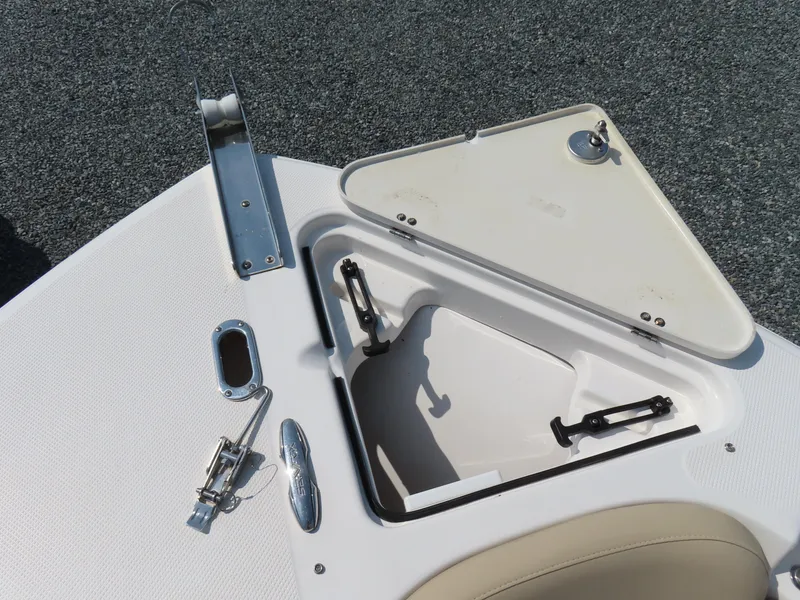 Slide: The Image of 2018 Sea Fox 226 Commander anchor storage compartment with open hatch and stainless steel fittings. - 14