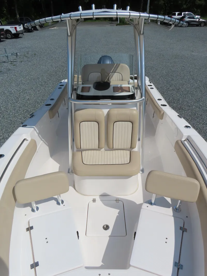 Slide: The Image of 2018 Sea Fox 226 Commander boat interior with beige seating and center console. - 15