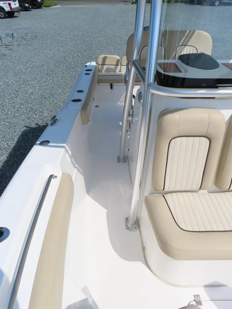 Slide: The Image of 2018 Sea Fox 226 Commander boat interior with beige seating and center console. - 16