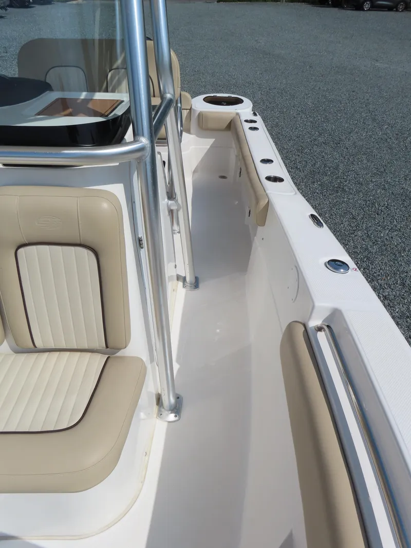 Slide: The Image of 2018 Sea Fox 226 Commander boat interior with beige seating and stainless steel railings. - 17