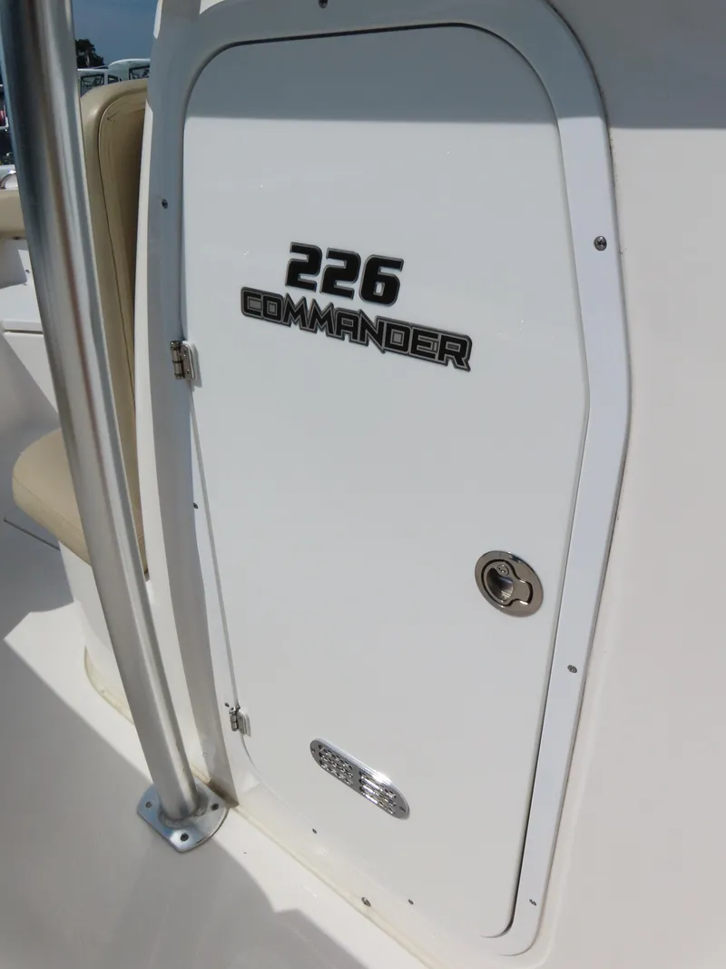Slide: The Image of 2018 Sea Fox 226 Commander boat door with model name and lock. - 19