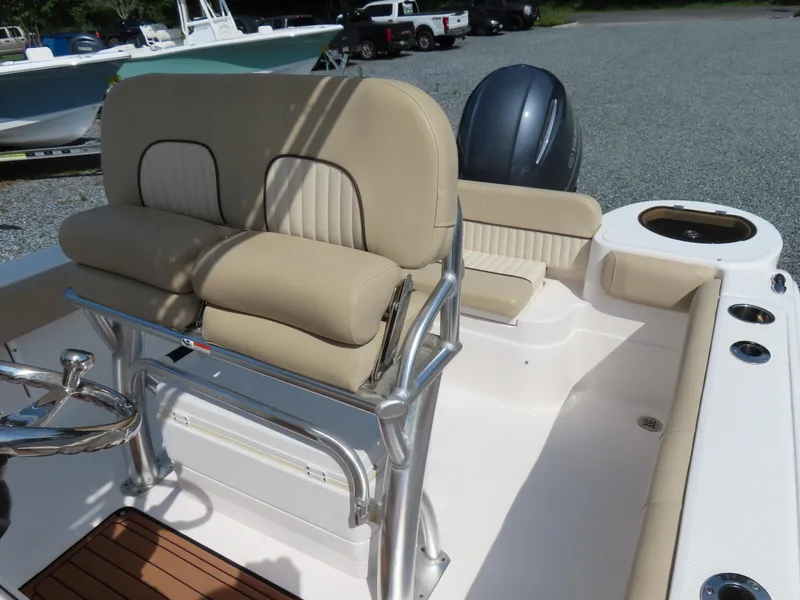 Slide: The Image of 2018 Sea Fox 226 Commander boat interior with beige seating and steering wheel. - 21