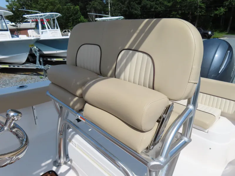 Slide: The Image of 2018 Sea Fox 226 Commander boat seat with beige upholstery and stainless steel frame. - 22