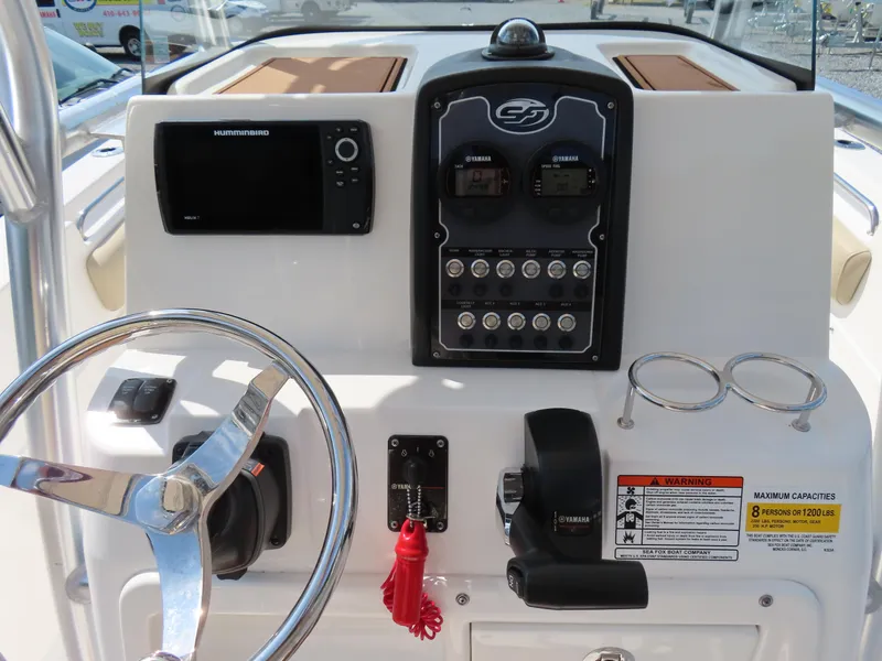 Slide: The Image of Control panel of 2018 Sea Fox 226 Commander boat with steering wheel and navigation instruments. - 25