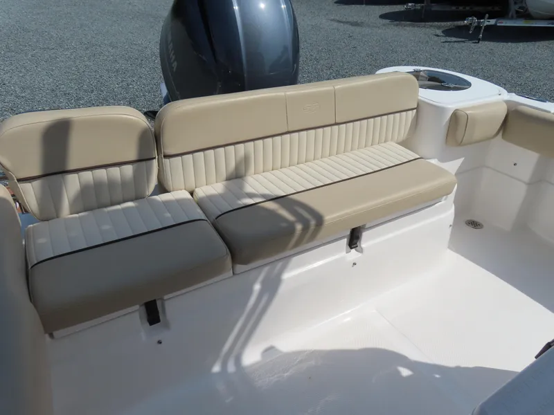 Slide: The Image of 2018 Sea Fox 226 Commander boat with beige cushioned seating and Yamaha engine. - 28