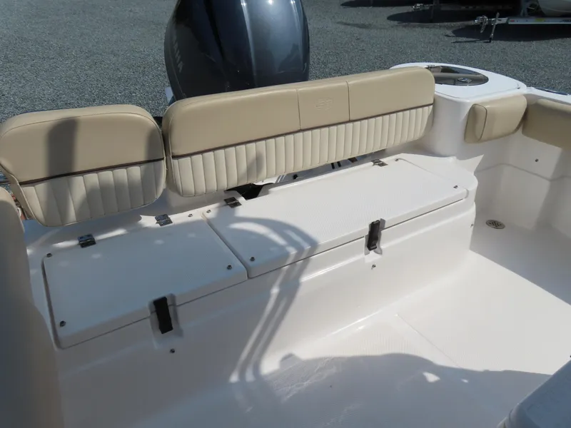 Slide: The Image of 2018 Sea Fox 226 Commander boat interior with beige seating and storage compartments. - 29