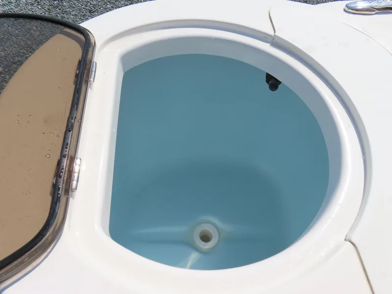 Slide: The Image of Livewell on 2018 Sea Fox 226 Commander boat, open lid, blue interior. - 33