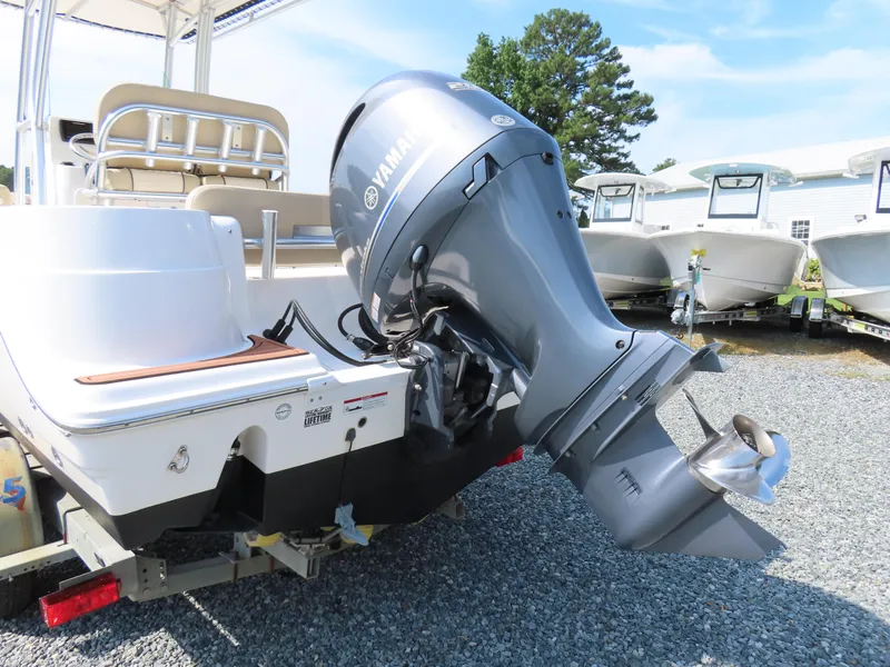 Slide: The Image of 2018 Sea Fox 226 Commander boat with Yamaha outboard motor, displayed on gravel lot. - 4