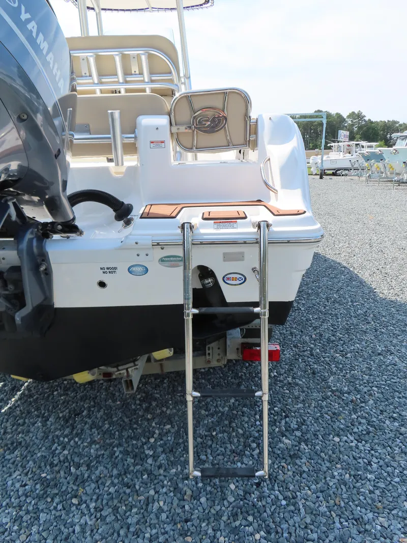 Slide: The Image of 2018 Sea Fox 226 Commander boat with ladder and Yamaha engine on gravel surface. - 6