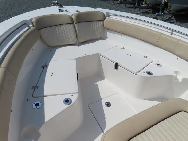 Slide: The Image of 2018 Sea Fox 226 Commander boat interior with beige seating and storage compartments. - 8