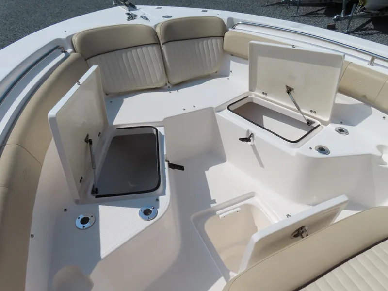 Slide: The Image of 2018 Sea Fox 226 Commander boat interior with open storage compartments and cushioned seating. - 9
