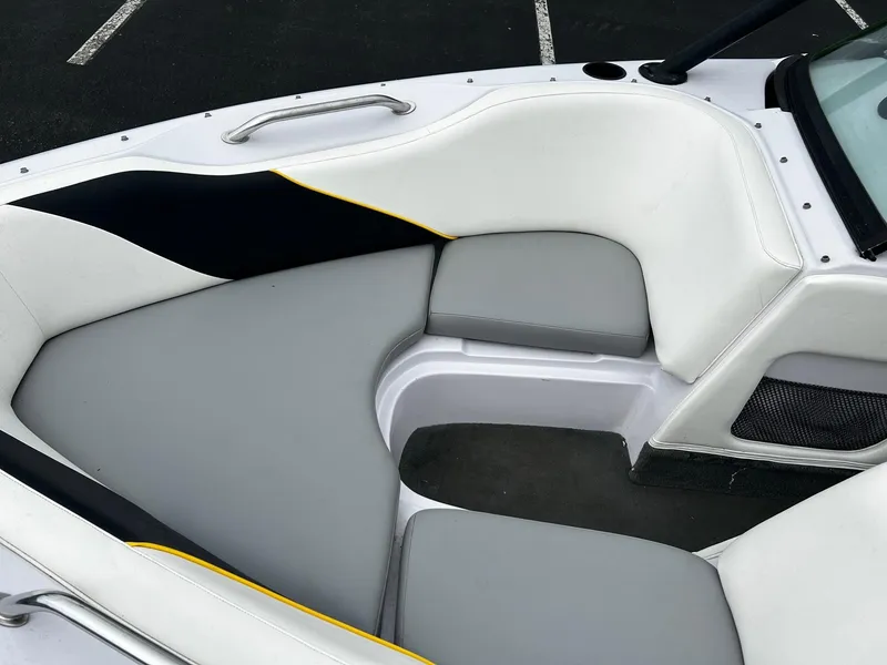 Slide: The Image of 2000 Correct Craft Air Nautique boat interior with gray and white seating. - 5