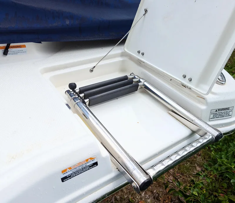 Slide: The Image of 2016 Chaparral 216 SSi boat swim platform with foldable ladder. - 7