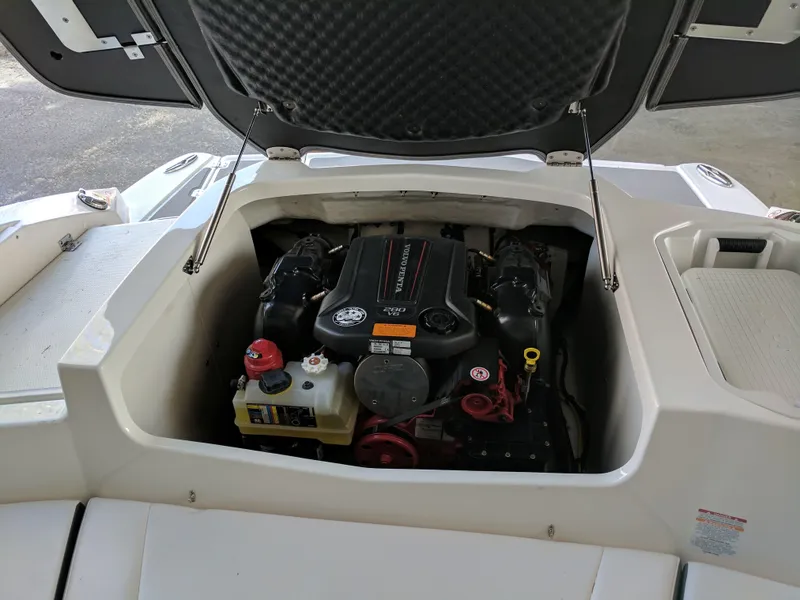 Slide: The Image of 2016 Chaparral 216 SSi boat engine compartment with open hatch. - 9