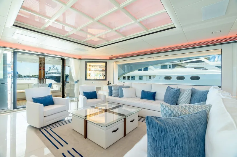 Slide: The Image of Luxurious interior of 2025 Horizon 122RP yacht with elegant seating and ocean view. - 1