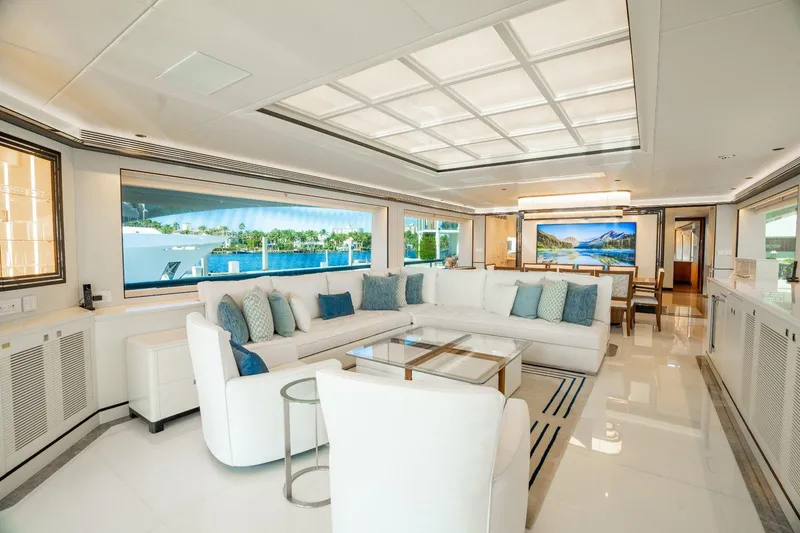 Slide: The Image of Luxurious dining area on 2025 Horizon 122RP yacht with ocean view and elegant decor. - 2