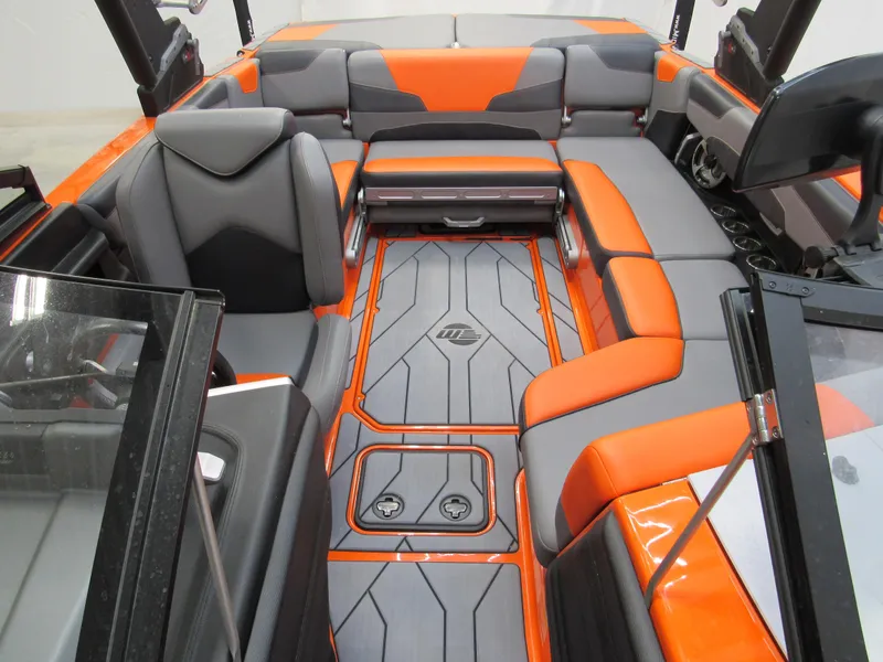 Slide: The Image of 2021 Malibu Wakesetter 22 LSV interior with orange and gray seating, modern design. - 10
