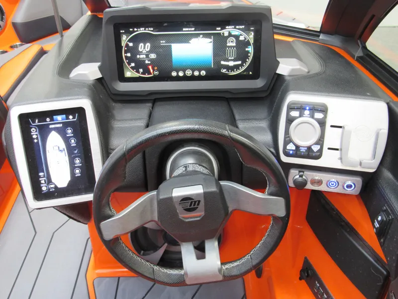 Slide: The Image of 2021 Malibu Wakesetter 22 LSV dashboard with digital displays and controls. - 7