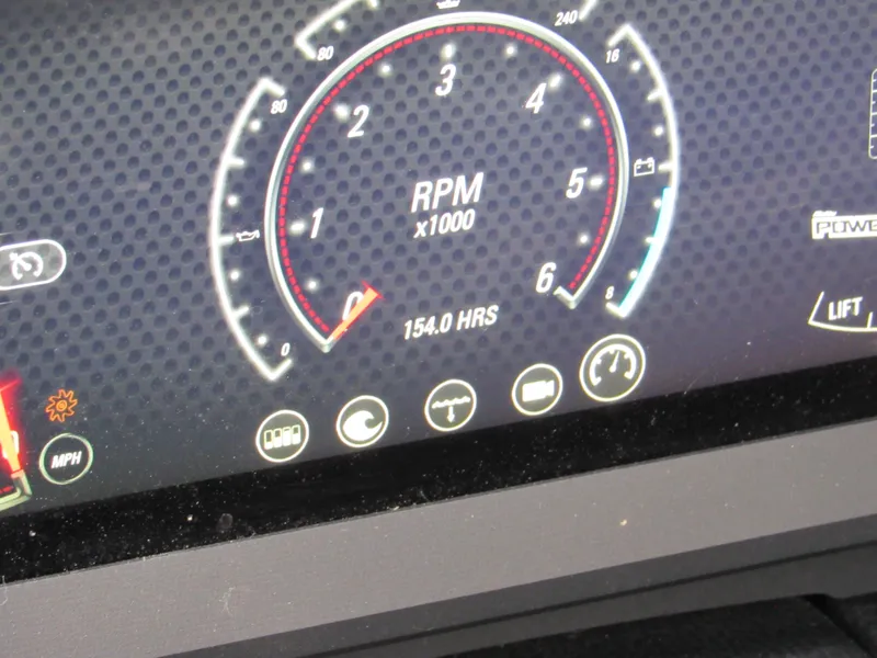 Slide: The Image of Dashboard of 2021 Malibu Wakesetter 22 LSV showing RPM and 154 hours usage. - 8