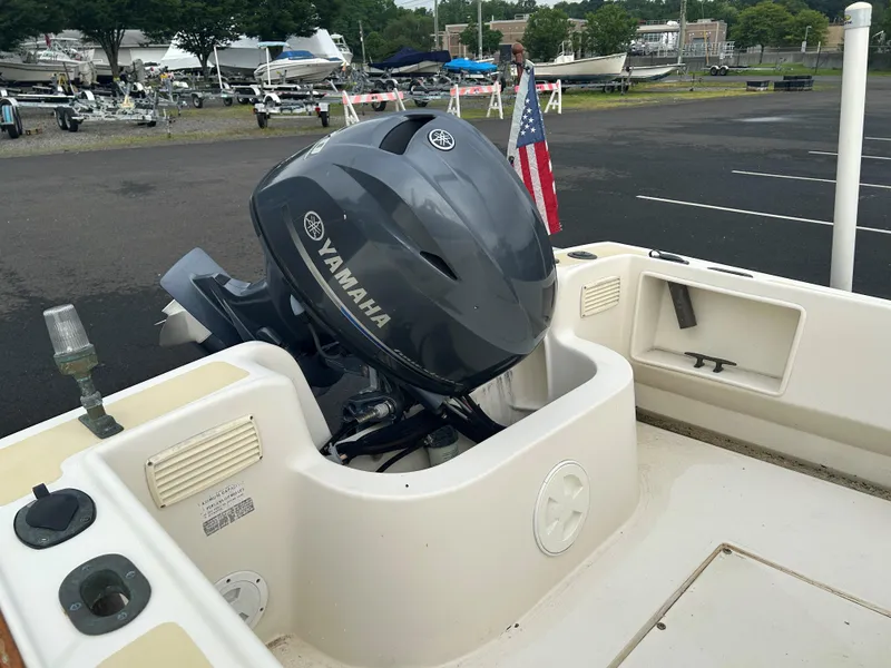 Slide: The Image of 2014 Nantucket Boat Works 17 Skiff with Yamaha outboard motor in a parking lot. - 10